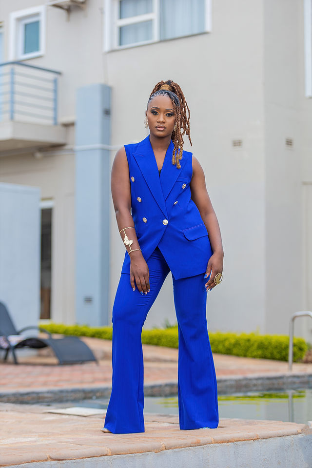 Outdoor fashion portrait in a blue suit